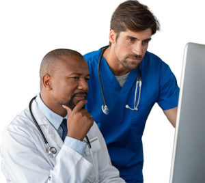 Two clinicians looking at computer
